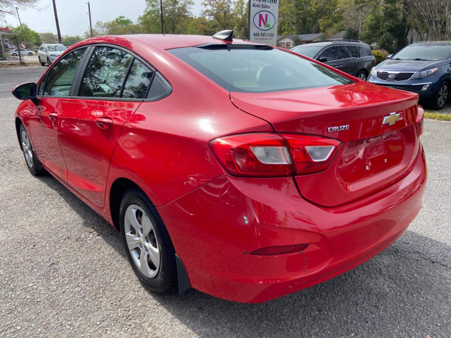 2016 RED CHEVROLET CRUZE LS AUTO (1G1BC5SM7G7) with an 1.4L engine, Automatic transmission, located at 5103 Dorchester Rd., Charleston, SC, 29418-5607, (843) 767-1122, 36.245171, -115.228050 - Photo#4